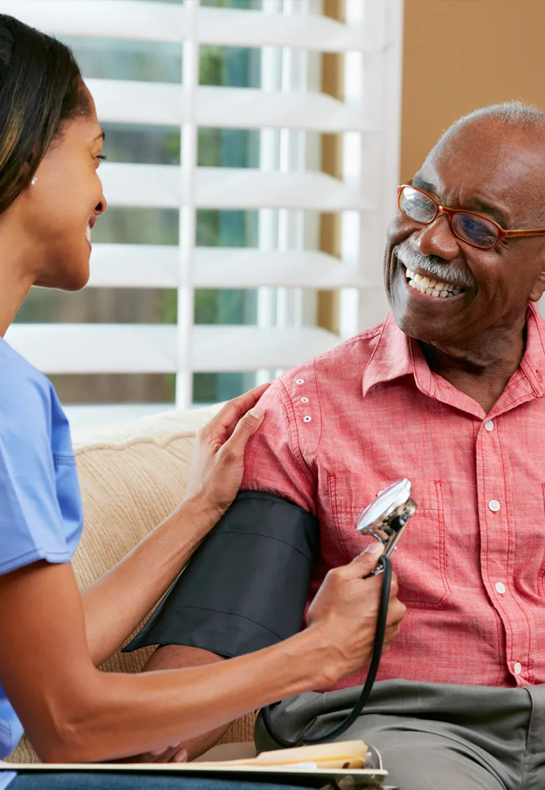 Caregiver with senior client at home